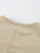 NEWYORKLISTED STYLE COLLECTION: Close-up of a beige garment with a plain background