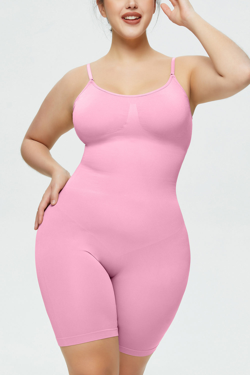 NEWYORKLISTED Intimate Apparel Collection: Person wearing a pink bodysuit against a plain background
