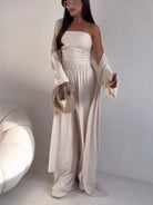 NEWYORKLISTED COMFORT COLLECTION: Woman wearing a white outfit with a plain background