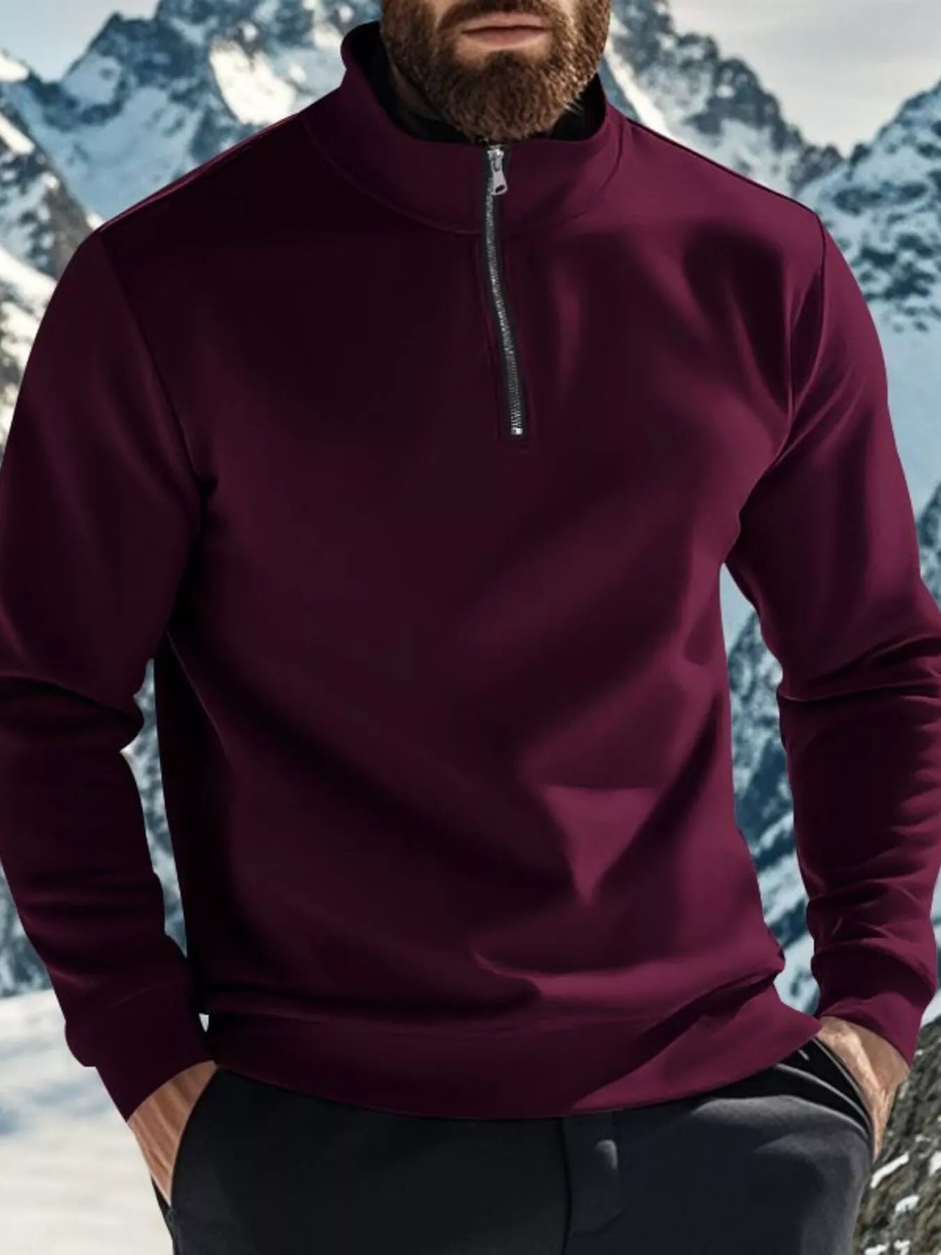 NEWYORKLISTED ATLAS MEN'S COLLECTION: Person wearing a maroon pullover with a zipper in a snowy mountain landscape