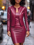 NEWYORKLISTED STYLE COLLECTION: Woman wearing a maroon leather outfit on a city street.