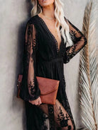 NEWYORKLISTED STYLE COLLECTION: Woman wearing a black lace dress with sheer sleeves against a neutral background