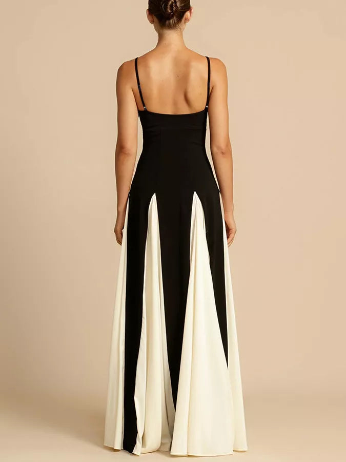 NEWYORKLISTED STYLE COLLECTION: Woman wearing a black and white jumpsuit on a beige background