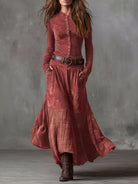 NEWYORKLISTED Style Collection: Woman wearing a long rust-colored dress with a plaid pattern against a gray background
