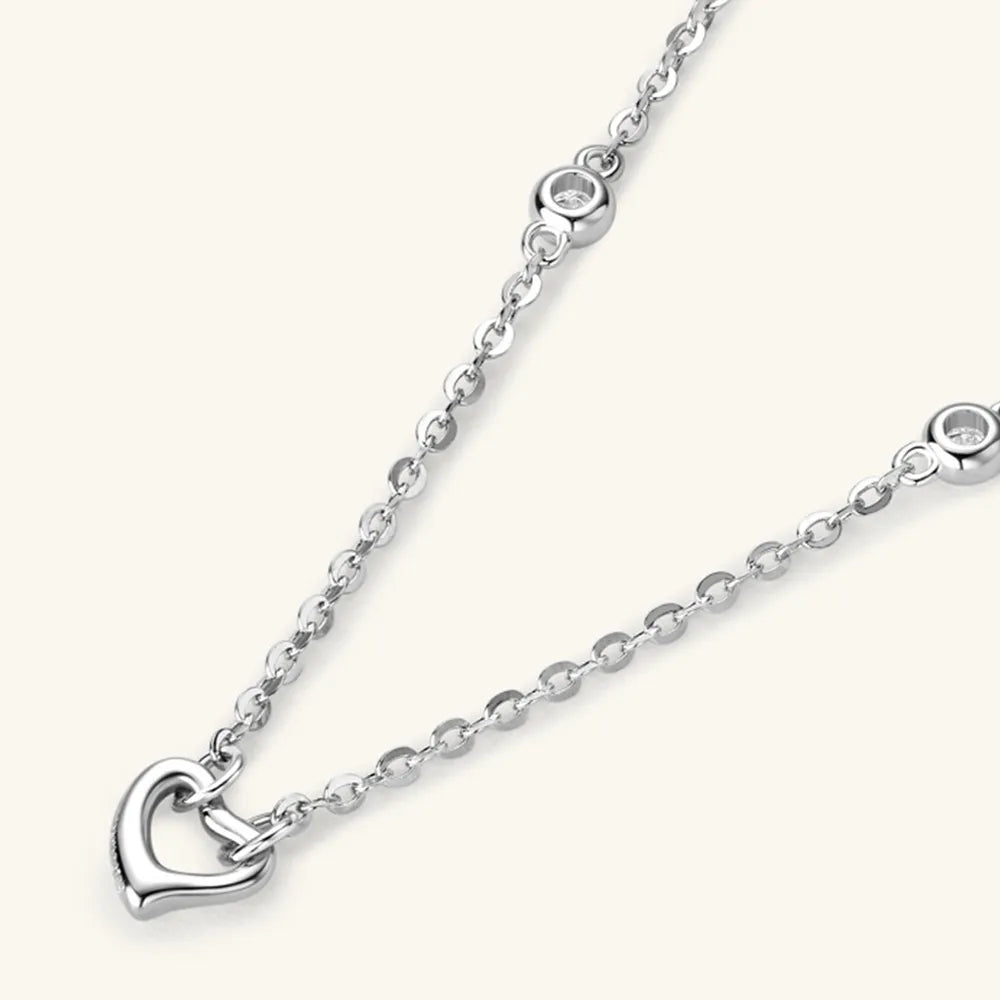 NEWYORKLISTED Valentine’s Day Specials: Silver necklace with a heart pendant on a white background