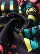 NEWYORKLISTED ACTIVEWEAR COLLECTION: Close-up of colorful fabric with abstract patterns on a black background