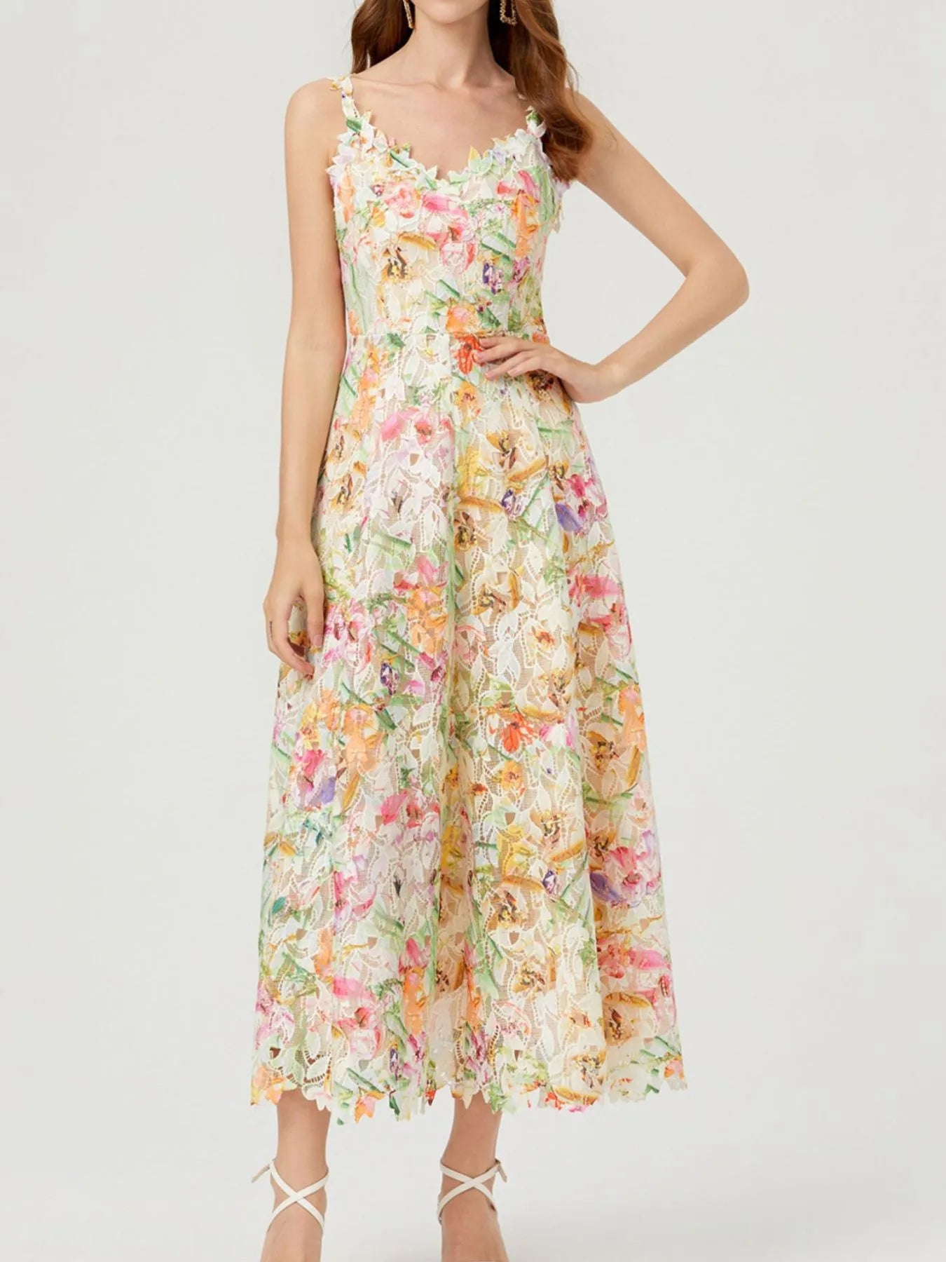 NEWYORKLISTED STYLE COLLECTION: Woman wearing a floral dress on a white background