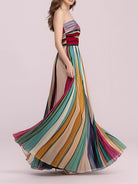 NEWYORKLISTED STYLE COLLECTION: Multicolored striped dress on a model against a light pink background
