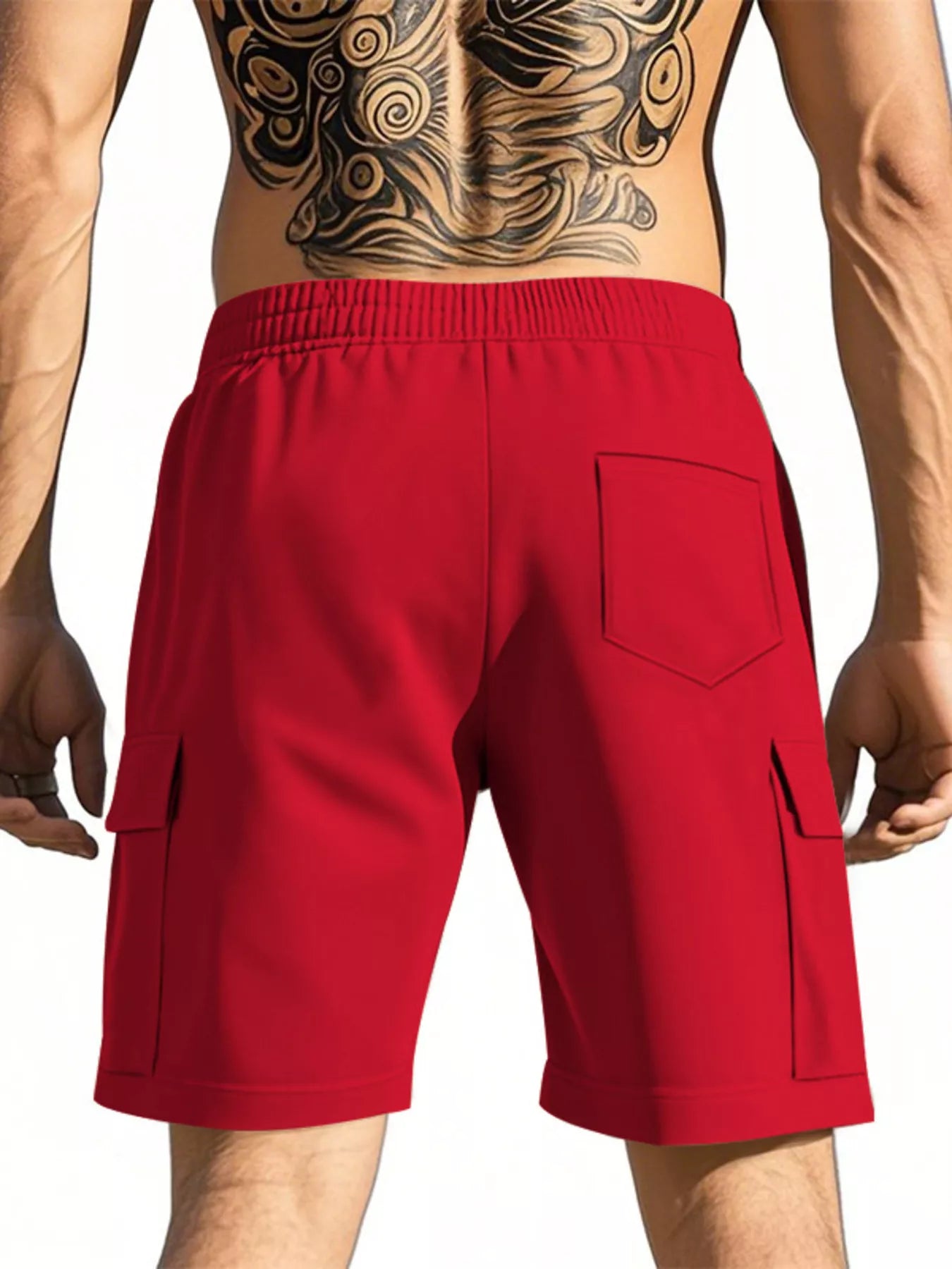 NEWYORKLISTED ATLAS MEN'S COLLECTION: Red cargo shorts worn by a person with tattoos on a plain background