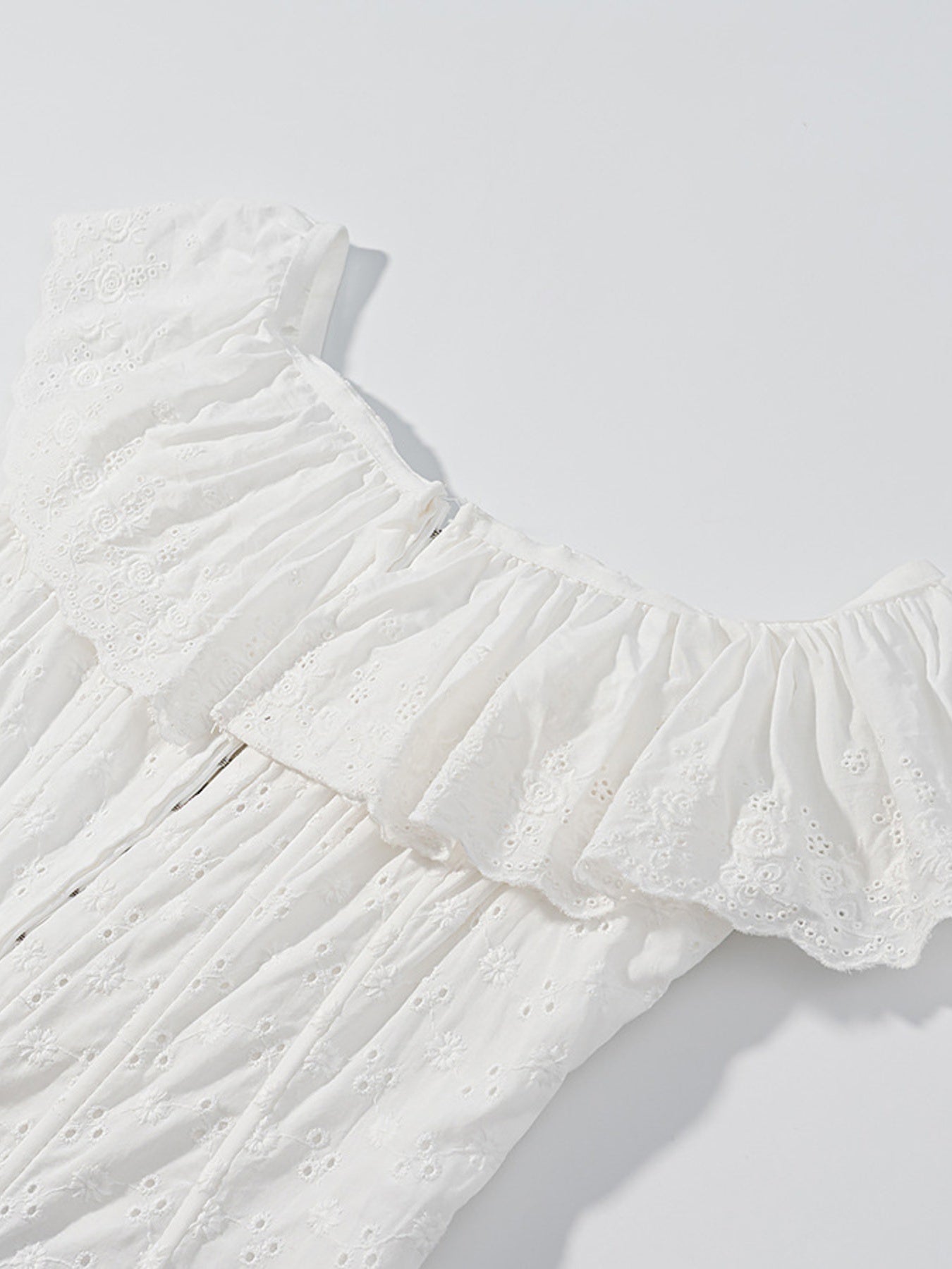 NEWYORKLISTED STYLE COLLECTION: White lace top on a light gray background