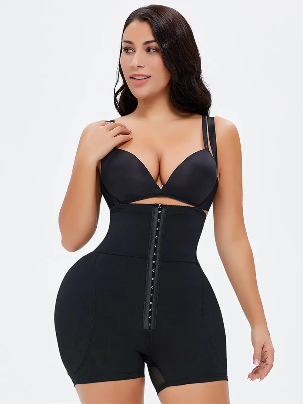 NEWYORKLISTED Intimate Apparel: Woman wearing a black shapewear bodysuit on a white background