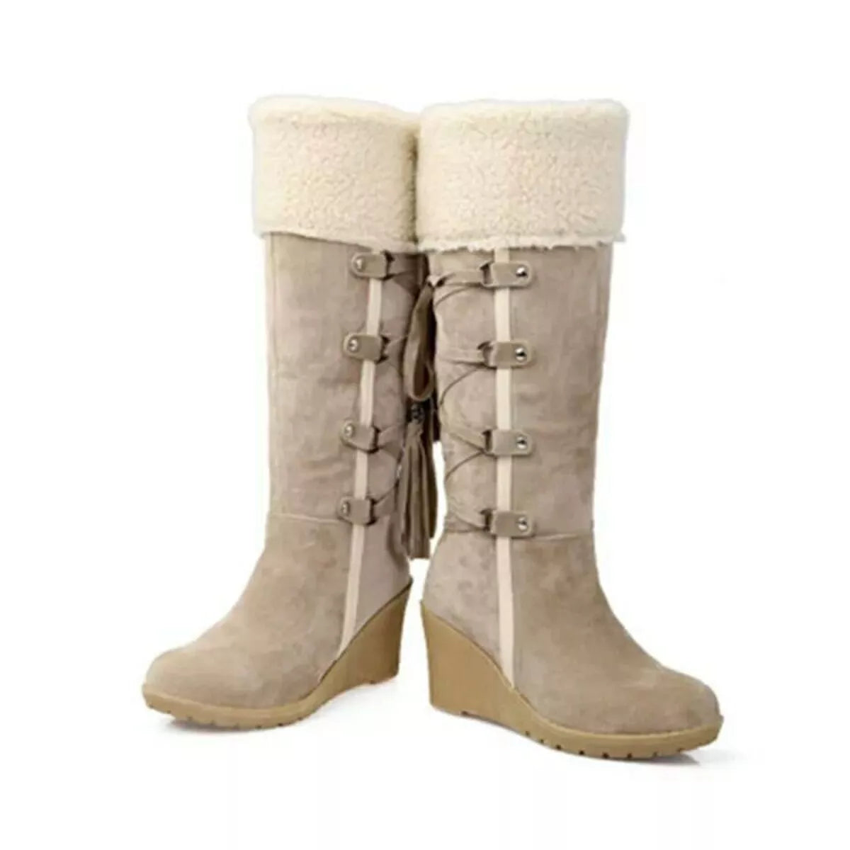 NEWYORKLISTED SHOE COLLECTION: Pair of beige knee-high boots with white fur lining on a white background
