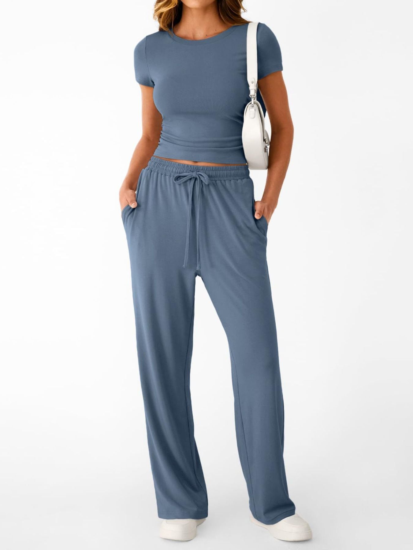 NEWYORKLISTED COMFORT COLLECTION: Woman wearing a blue outfit with a white background