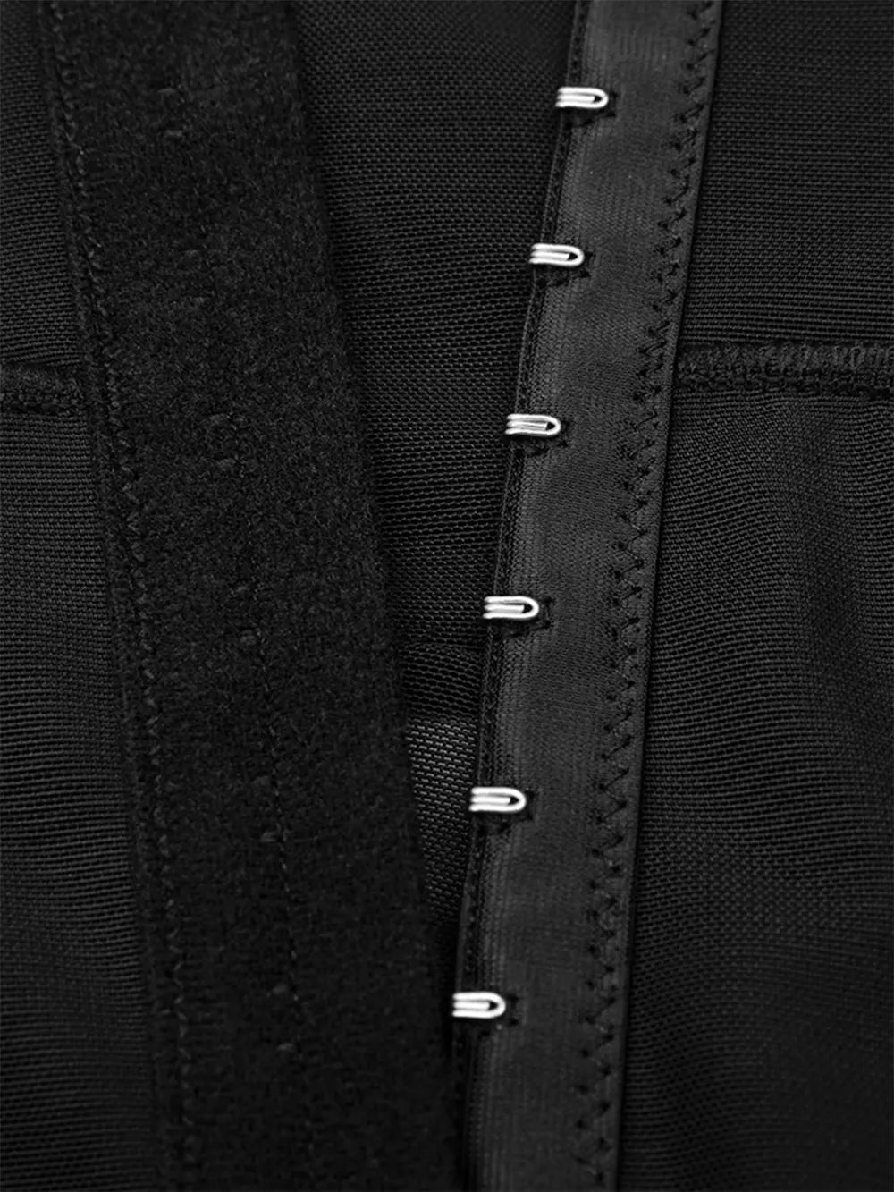NEWYORKLISTED Intimate Apparel: Close-up of a black garment with button details