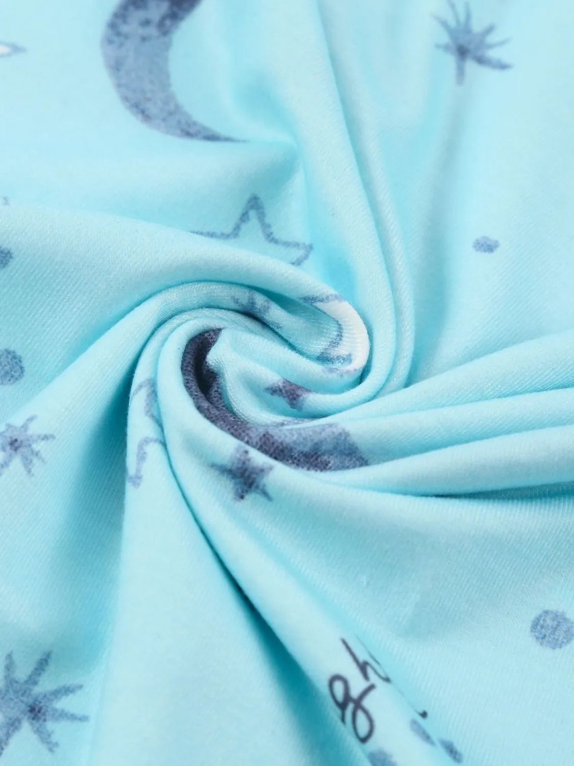NEWYORKLISTED Intimate Apparel: Light blue fabric with star patterns, possibly from a children's product or clothing.