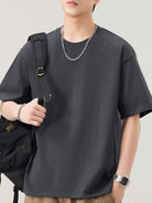NEWYORKLISTED ATLAS MEN"S COLLECTION: Person wearing a black t-shirt with a plain background