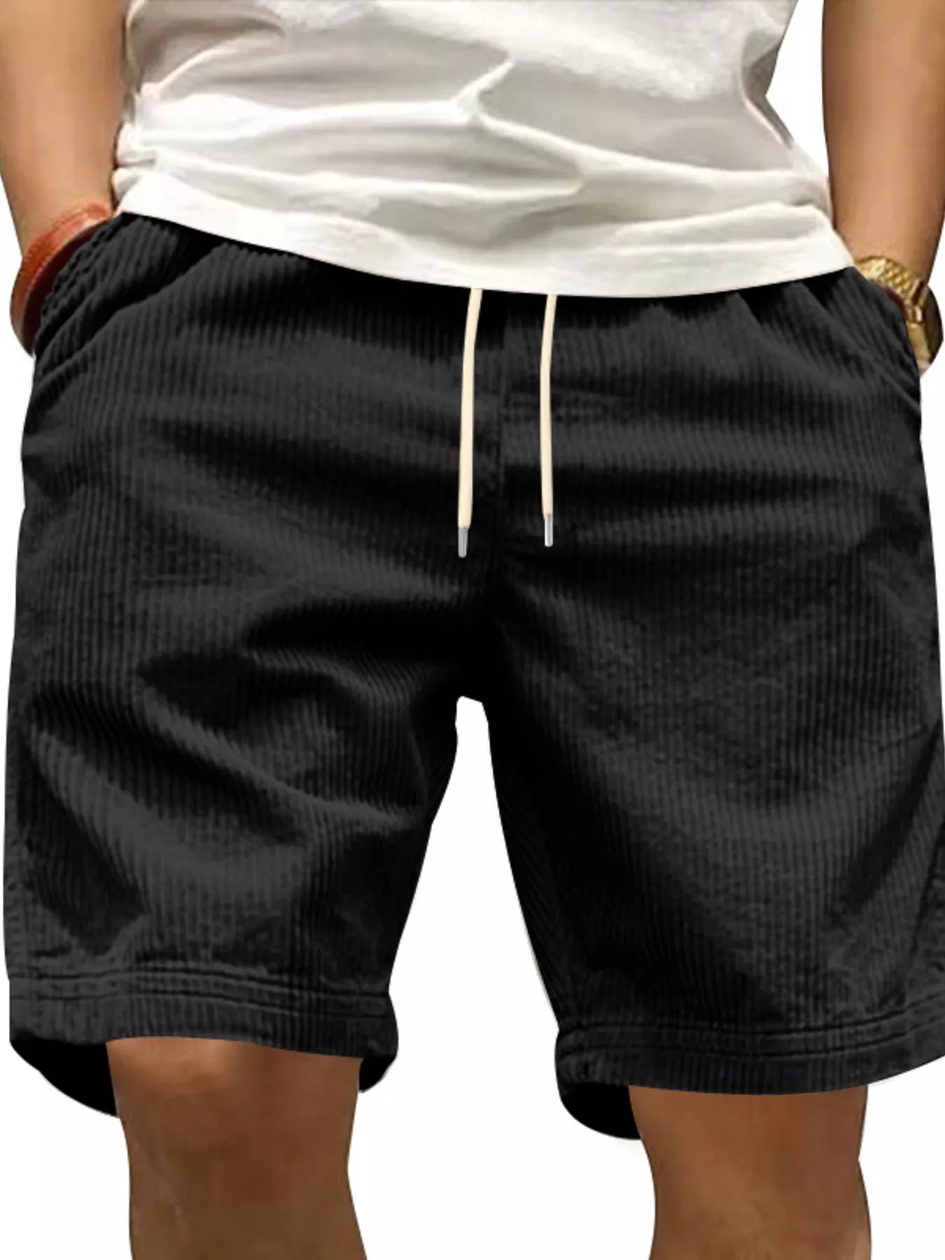 NEWYORKLISTED ATLAS MEN'S COLLECTION: Black shorts worn by a person on a plain background