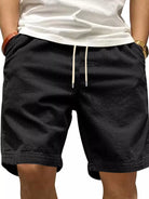 NEWYORKLISTED ATLAS MEN'S COLLECTION: Black shorts worn by a person on a plain background