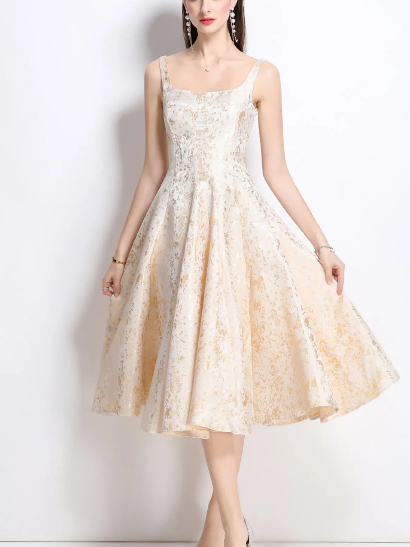 NEWYORKLSITED STYLE COLLECTION: Woman wearing a beige lace dress against a white background