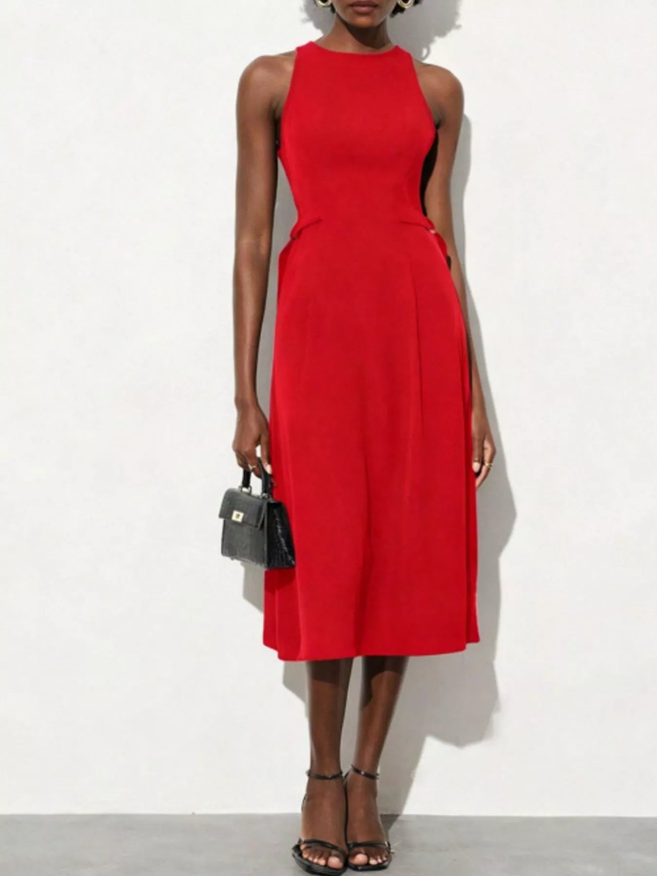 NEWYORKLISTED STYLE COLLECTION: Red dress worn by a model on a white background
