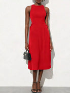 NEWYORKLISTED STYLE COLLECTION: Red dress worn by a model on a white background
