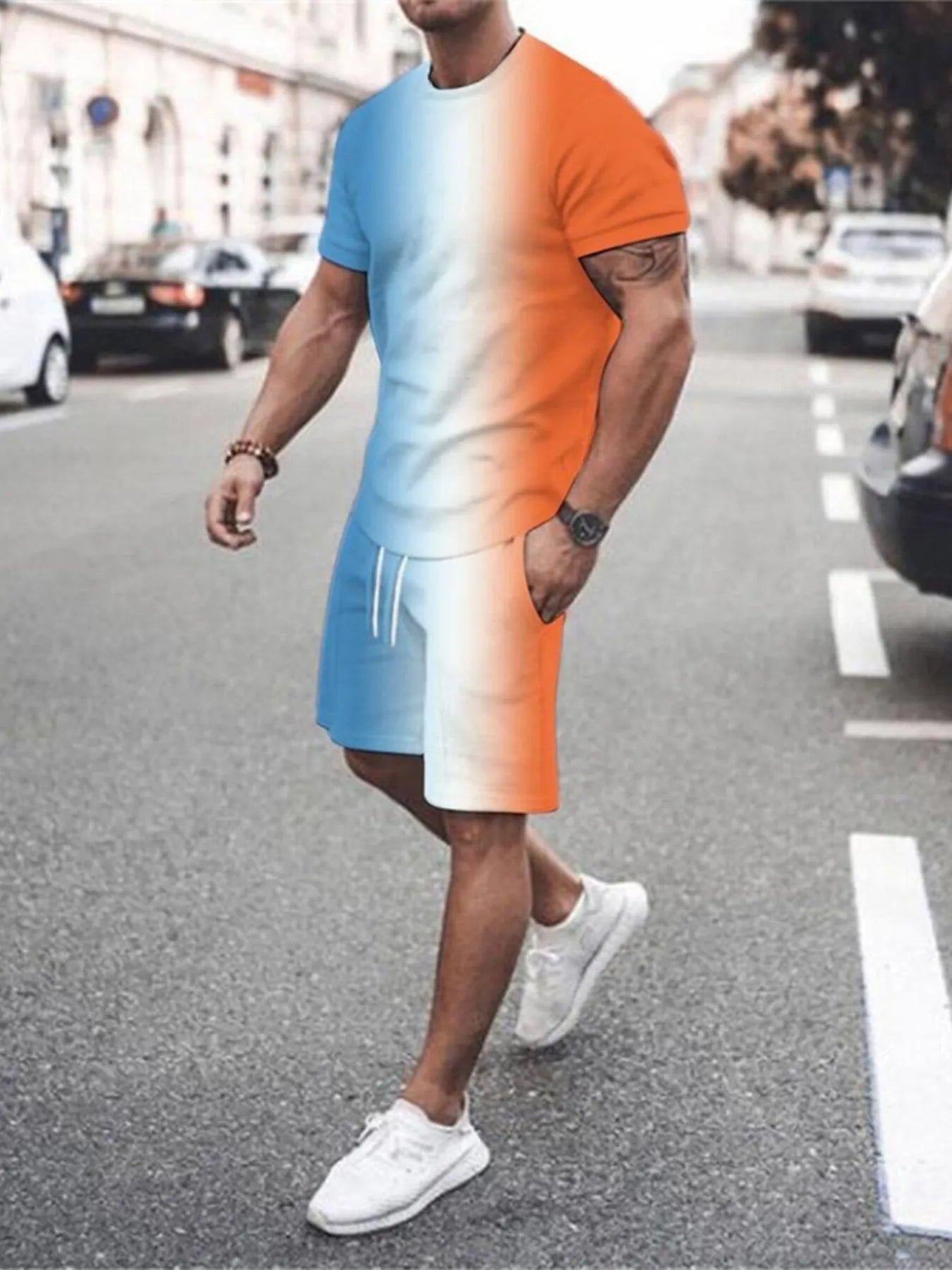 NEWYORKLISTED ATLAS MEN's COLLECTION: Person wearing a gradient t-shirt and shorts walking on a street.