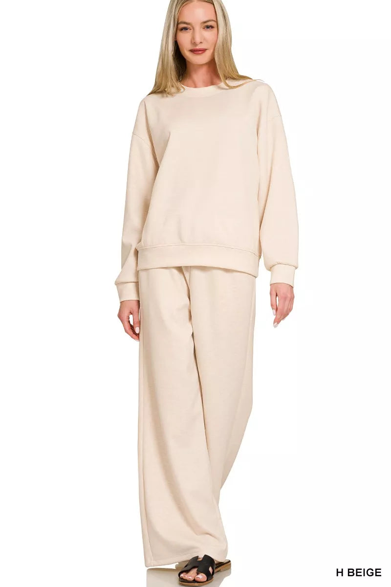 NEWYORKLISTED STYLE COLLECTION: Woman wearing a beige outfit on a white background