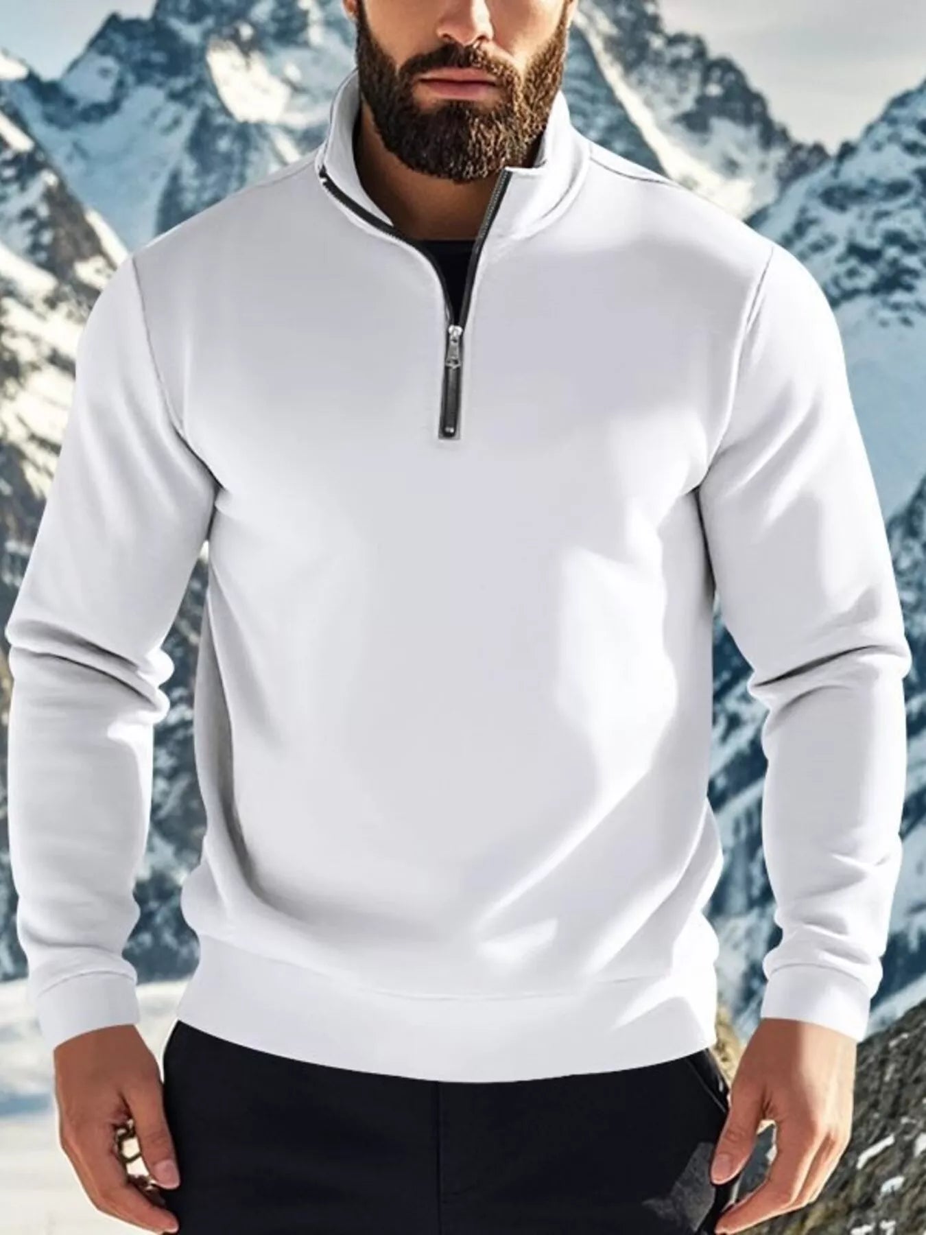 NEWYORKLISTED ATLAS MEN'S COLLECTION: Person wearing a white quarter-zip sweatshirt with a mountainous background