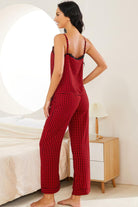 NEWYORKLISTED Intimate Apparel: Woman wearing a red plaid pajama set in a bedroom setting.