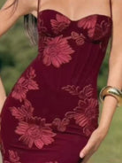 NEWYORKLISTED STYLE COLLECTION: Red strapless dress with floral patterns worn by a person outdoors.