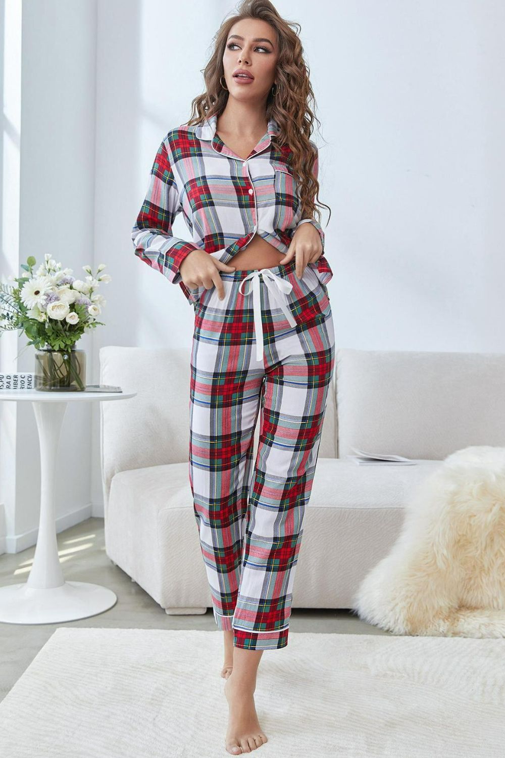 NEWYORKLISTED Intimate Apparel: Woman wearing a plaid pajama set in a living room.