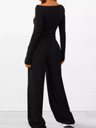 NEWYORKLISTED COMFORT COLLECTION: Long Sleeve Top and Wide Leg Pants Set: Black jumpsuit worn by a person on a white background