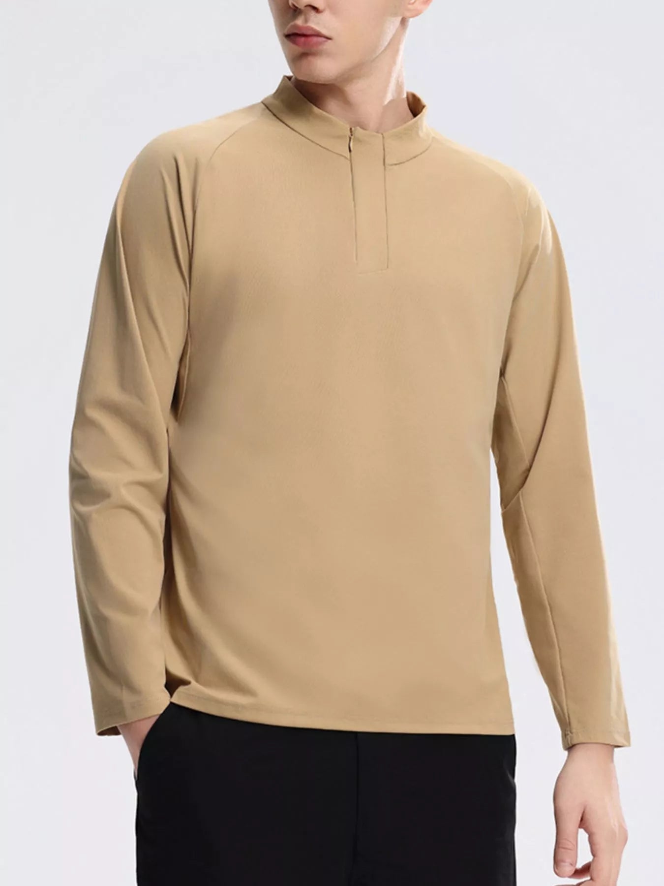 NEWYORKLISTED ATLAS MEN's COLLECTION: Person wearing a beige long-sleeve shirt against a white background