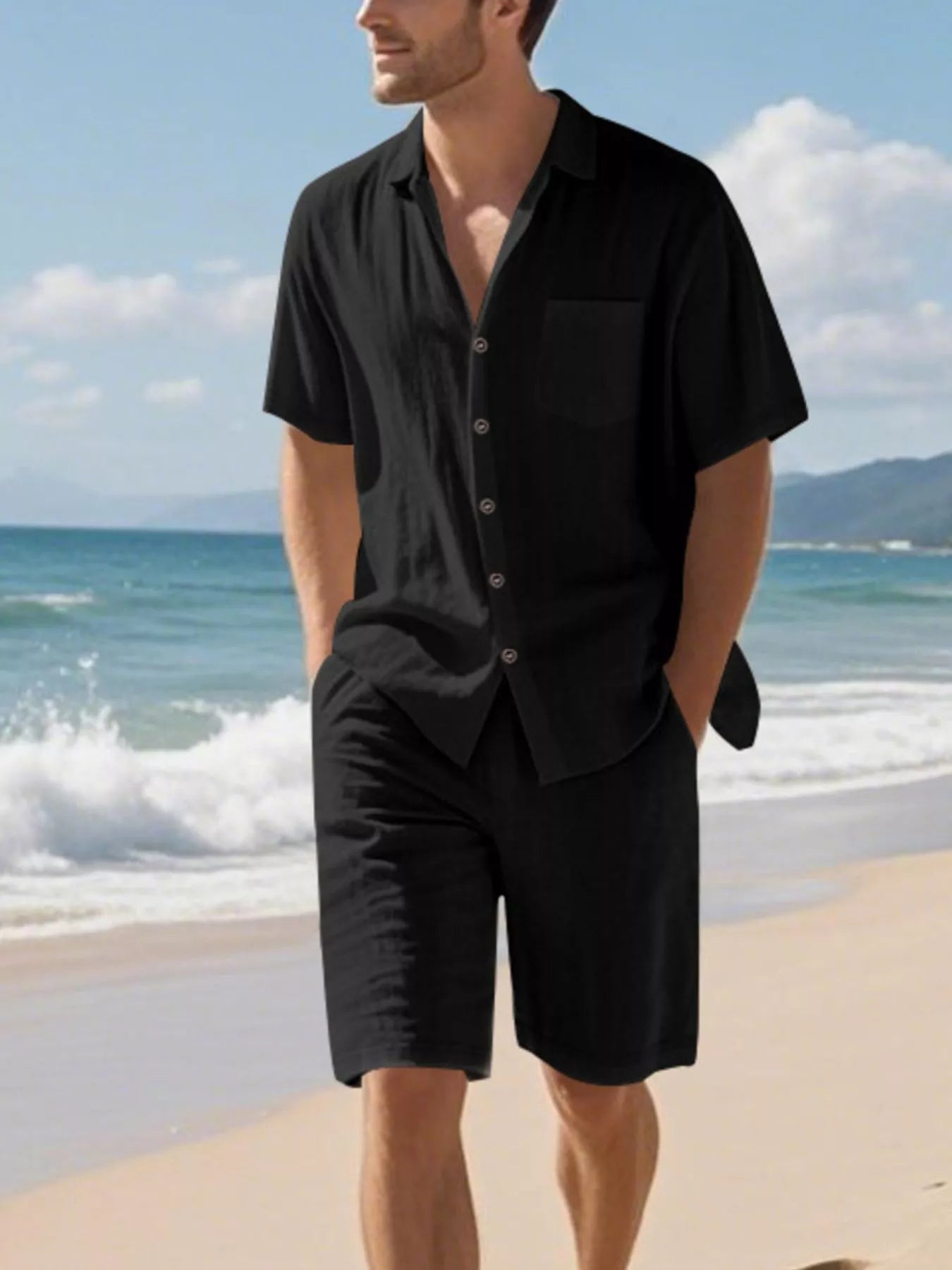 NEWYORKLISTED ATLAS MEN'S COLLECTION: Man wearing a black shirt and shorts on a beach