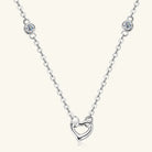 NEWYORKLISTED Valentine’s Day Specials: Silver necklace with a heart-shaped pendant on a white background
