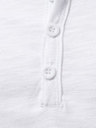 NEWYORKLISTED ATLAS MEN'S COLLECTION: Close-up of a white shirt with buttons on a white background
