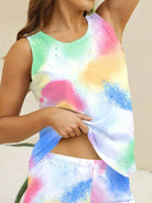 NEWYORKLISTED Intimate Apparel: Person wearing a colorful sleeveless top with watercolor design.