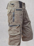 NEWYORKLISTED ATLAS MEN'S COLLECTION: Brown cargo shorts with multiple pockets and zippers on a light gray background