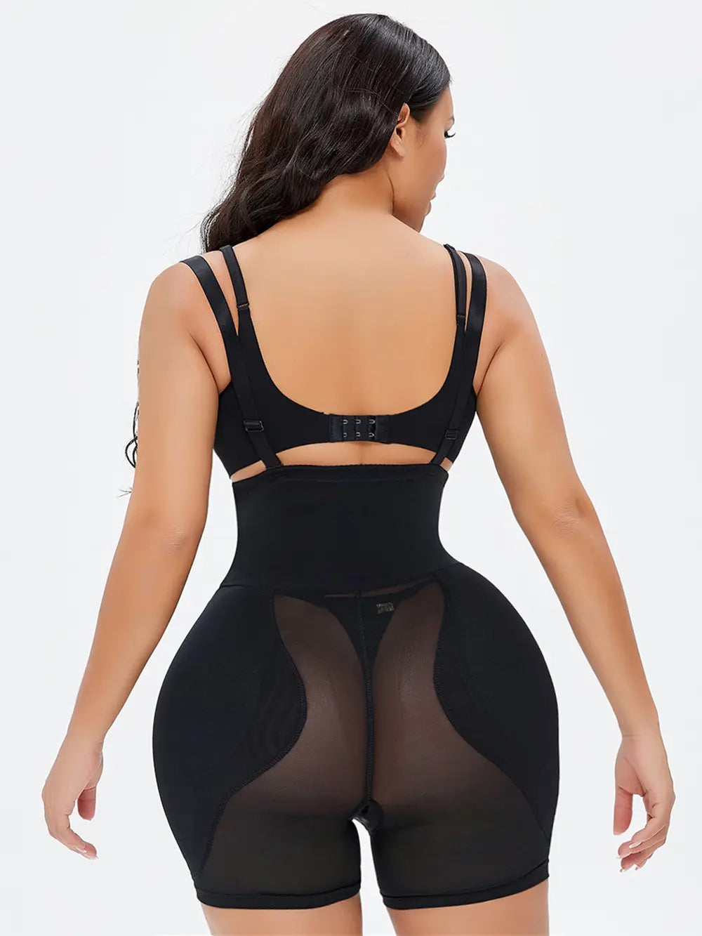 NEWYORKLISTED Intimate Apparel: Person wearing a black shapewear garment on a white background
