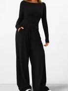 NEWYORKLISTED COMFORT COLLECTION: Long Sleeve Top and Wide Leg Pants Set: Black jumpsuit worn by a person on a white background