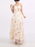 NEWYORKLISTED STYLE COLLECTION: Woman wearing a strapless floral gown on a white background
