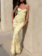 Woman wearing elegant embroidered lace sweetheart neckline spaghetti strap maxi dress with side split from NEWYORKLISTED STYLE COLLECTION