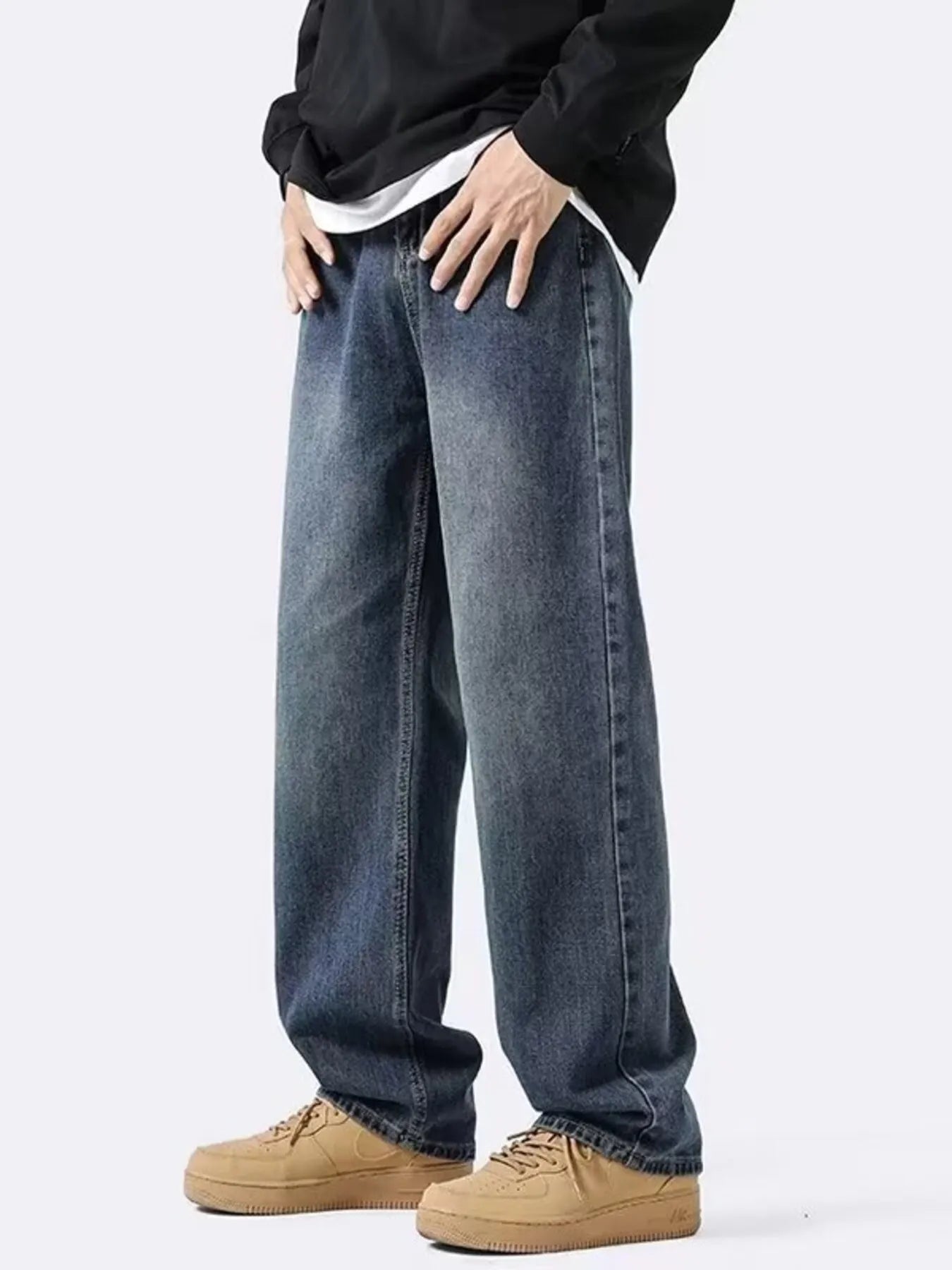 NEWYORKLISTED ATLAS MEN's COLLECTION: Person wearing blue jeans and beige shoes on a white background