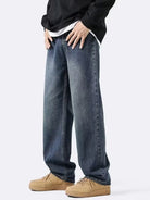 NEWYORKLISTED ATLAS MEN's COLLECTION: Person wearing blue jeans and beige shoes on a white background