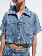 NEWYORKLISTED STYLE COLLECTION: Person wearing a blue denim jacket and shorts against a white background