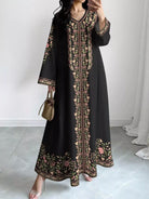 NEWYORKLISTED STYLE COLLECTION: Woman wearing a black dress with floral embroidery in a minimal indoor setting