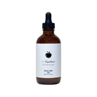 NEWYORKLISTED COSMETIC COLLECTION: Grow Hair Oil, Brown glass bottle with dropper labeled 'Grow Hair Oil' on a white background