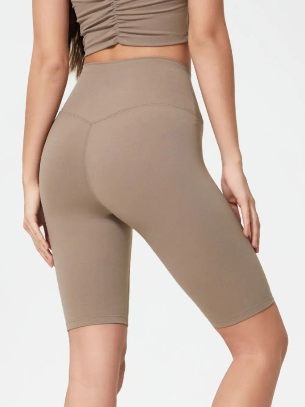 NEWYORKLISTED ACTIVEWEAR COLLECTION: Beige athletic shorts worn by a person on a light gray background