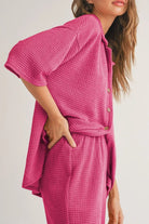 NEWYORKLISTED Comfort Collection: Woman wearing a pink textured outfit with a plain background