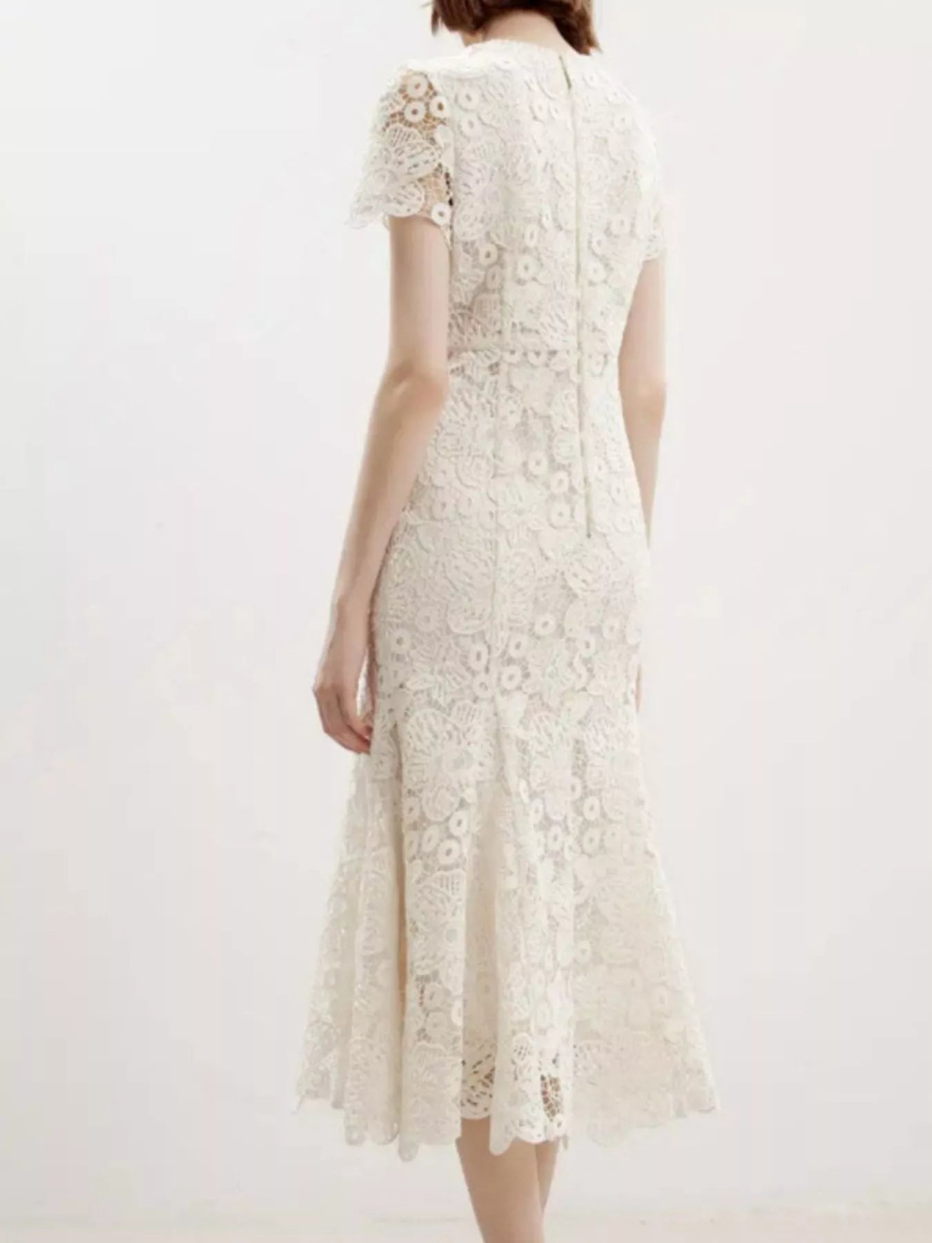 NEWYORKLISTED STYLE COLLECTION: White lace dress on a white background